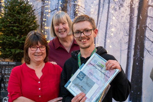 A picture of a representative from Pulp Friction being presented with their Best community garden award